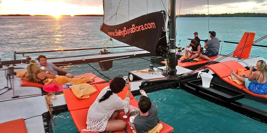Bora Bora: Sunset Catamaran Cruise with Snacks and Drinks - Settling into a catamaran for eight