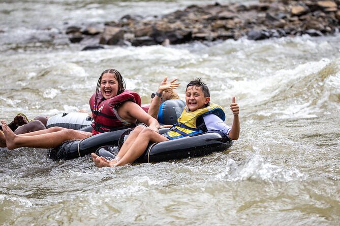 River Tubing Fiji, Navua River - Swimming beneath a Fiji waterfall