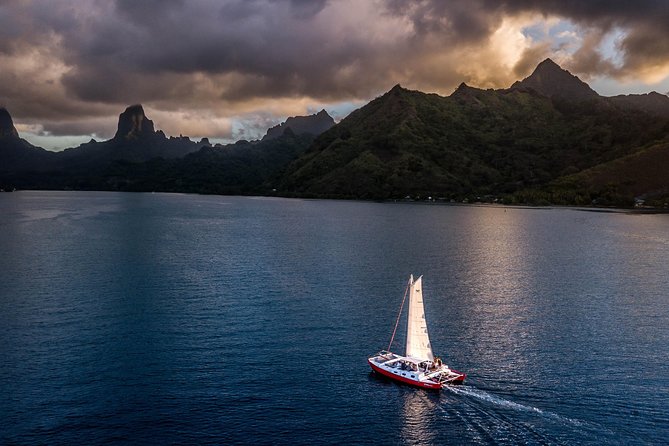 Sunset Cruise : Moorea Sailing on a Catamaran named Taboo - A small catamaran and a wide view of Moorea