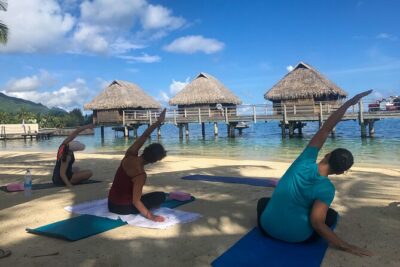 Yoga on the paradise beach of Manava Moorea